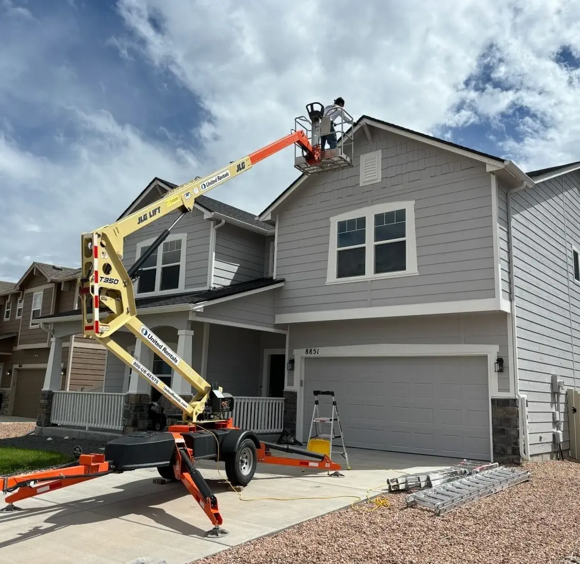 painting exterior trim with a boom lift